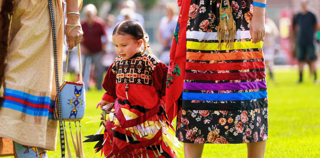 Child in red jingle dress from 2022 Powwow